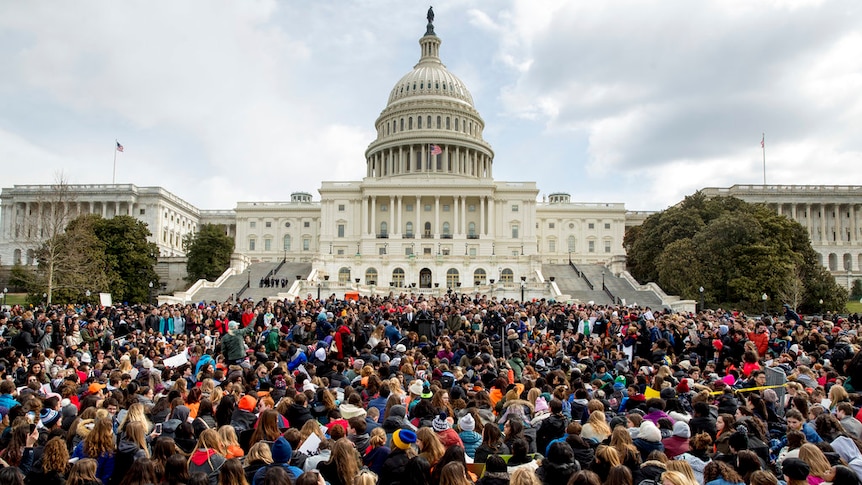 Thousands of students sit outside the US capitol in DC