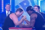 Ben Ross and Wendell Sailor face off in arm-wrestle