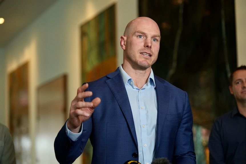 David Pocock holding a press conference at Parliament House