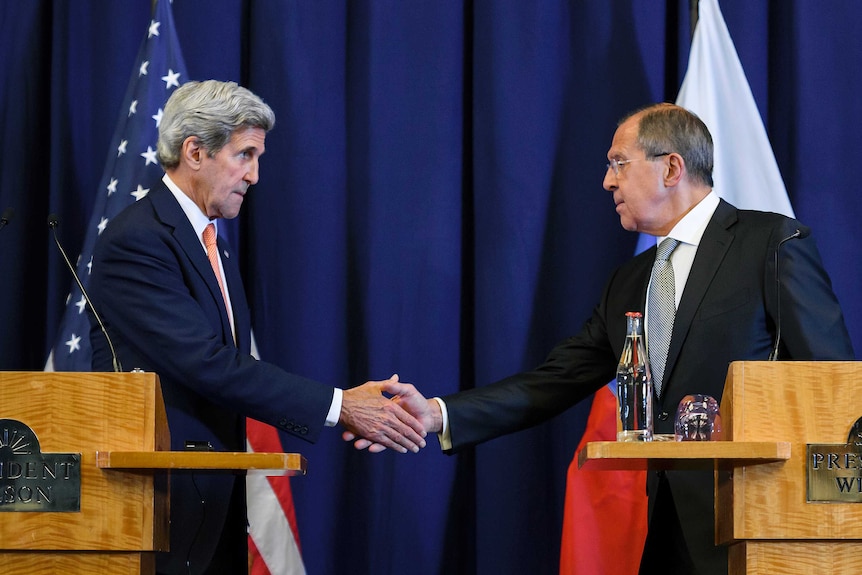 John Kerry and Sergei Lavrov shake hands