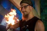 Brett Schmerl with flaming staff.