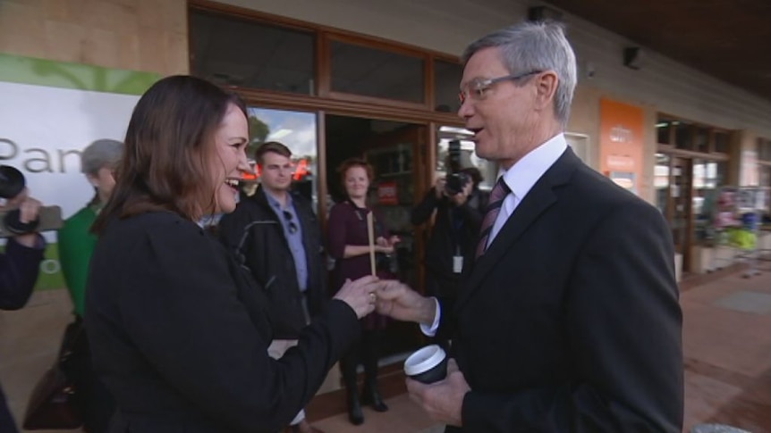 Labor candidate Tania Lawrence bumps into Liberal leader Mike Nahan