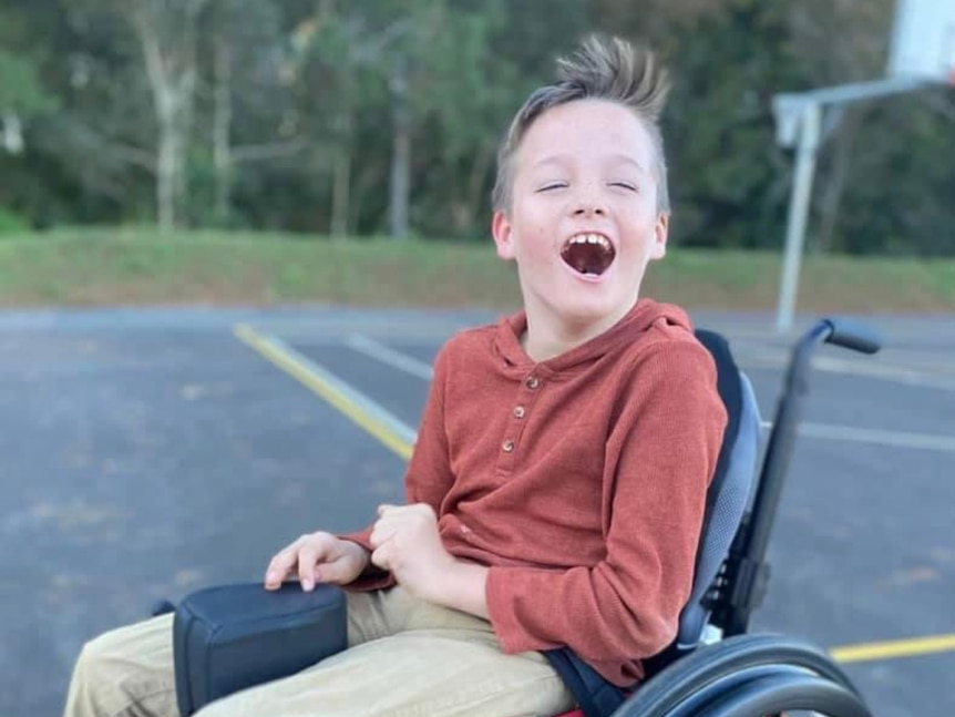 A boy in a wheelchair.