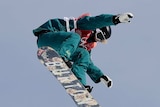 Jessica Rich jumps during big air snowboard qualifying