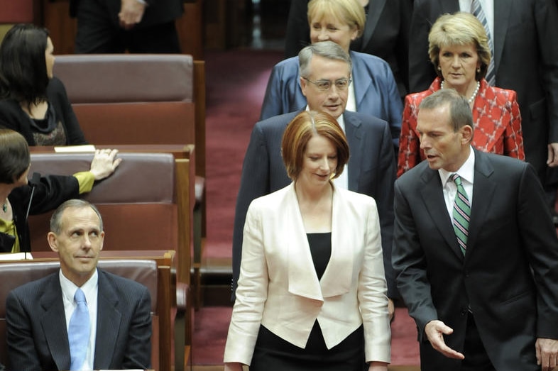 Prime Minister Julia Gillard and Opposition Leader Tony Abbott enter the Senate at the opening of the 43rd Parliament (AAP)