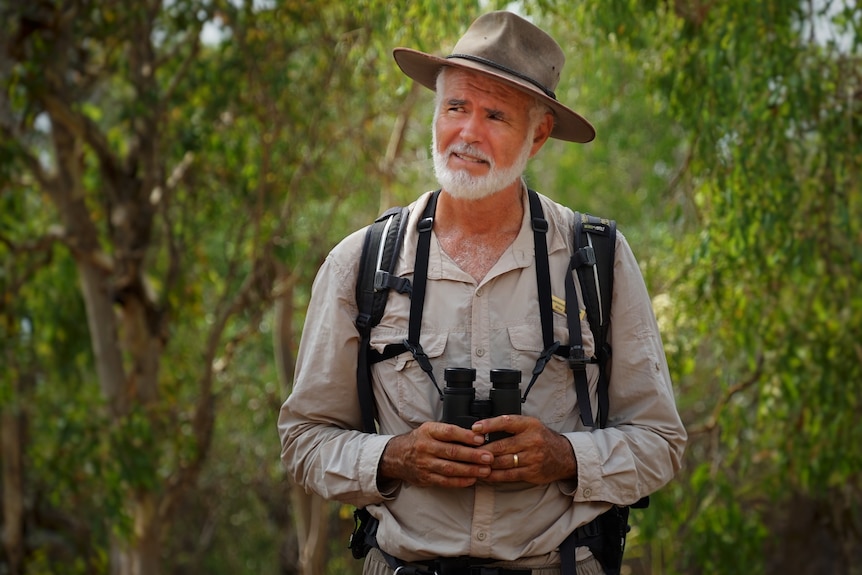 Mike Jarvis in Kakadu holding his binoculars