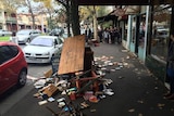 Books scattered on footpath at Carlton
