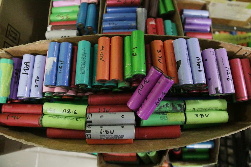 Colourful batteries in a box.