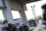 Thai soldiers run for cover near the Thai-Burma border in in Mae Sot as ethnic rebels clash with Burmese government troops.