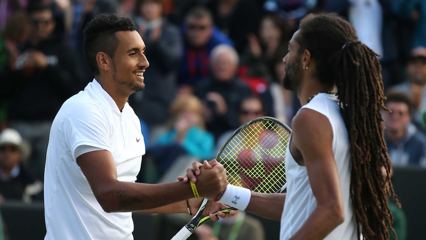 Nick Kyrgios shakes hands with Dustin Brown at Wimbledon