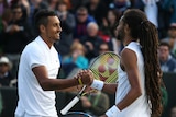 Nick Kyrgios shakes hands with Dustin Brown at Wimbledon