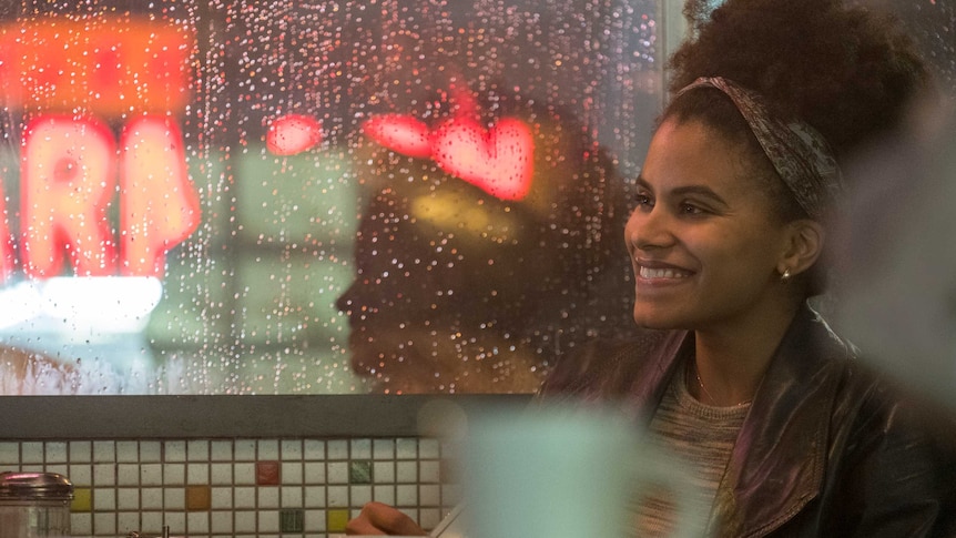 Actor Zazie Beetz in the movie Joker, a young black woman in a diner
