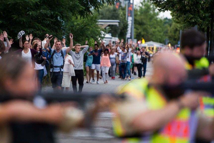 Police evacuate people from the shopping mall in Munich.