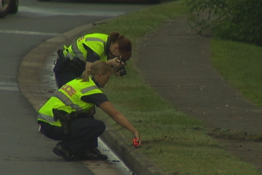 Police on the scene of a fatal hit and run at Toowong