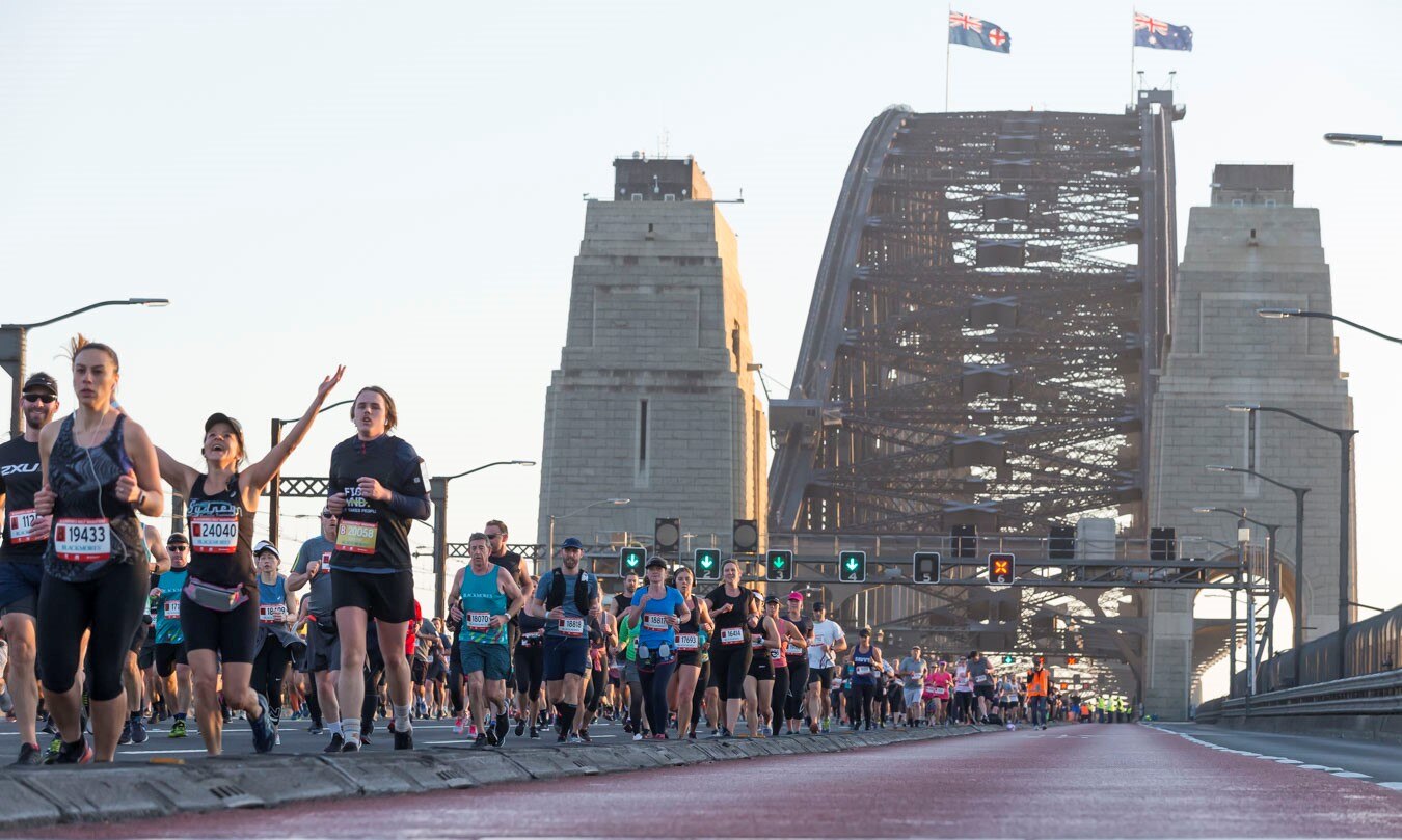 Marathon participants run across Sydney Harbour Bridge