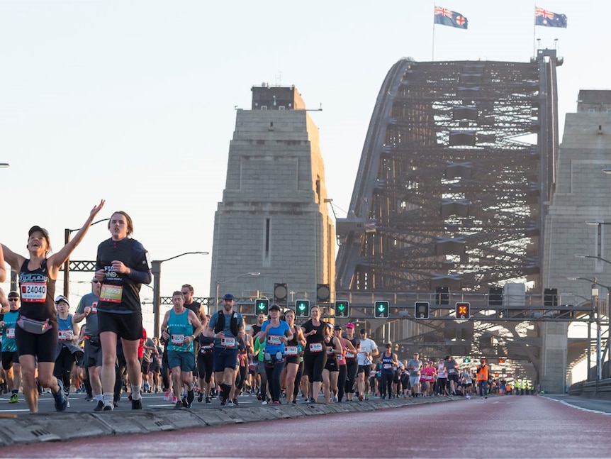 Marathon participants run across Sydney Harbour Bridge