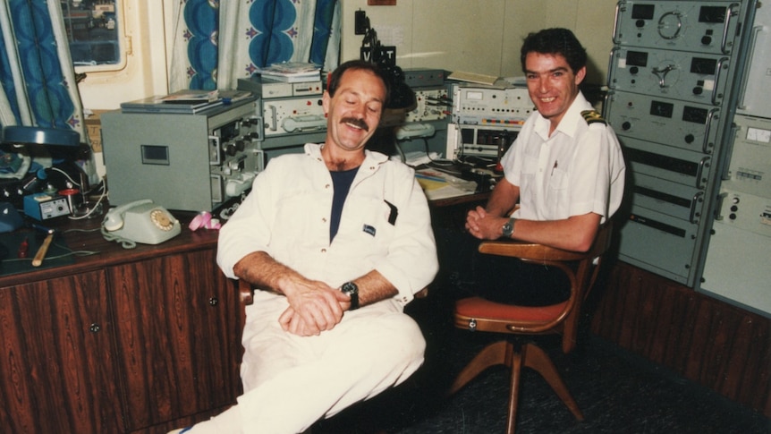 Two members in an old ferry control room.