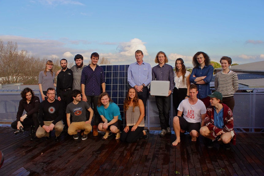 Stucco apartment students with newly installed solar panels and batteries