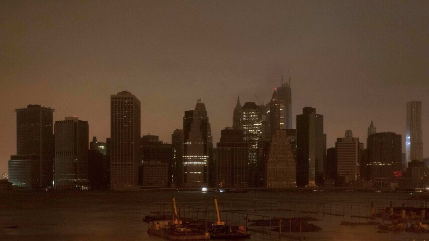 Darkness engulfs the Lower Manhattan skyline in New York City.