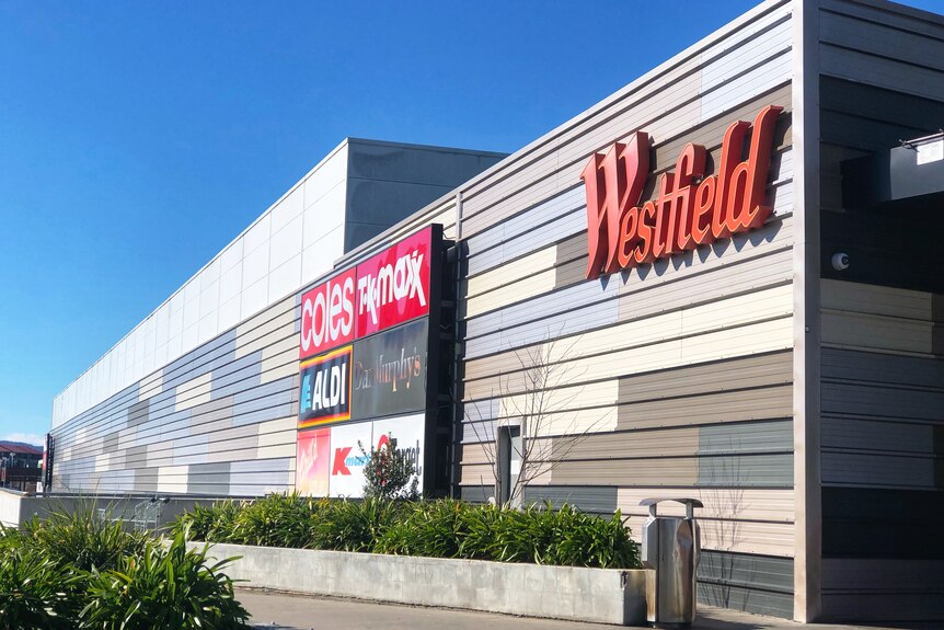 A Westfield shopping mall with the sign on the side.