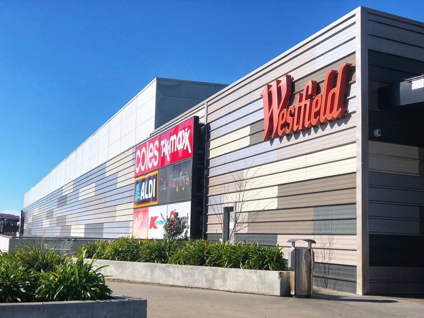 A Westfield shopping mall with the sign on the side.
