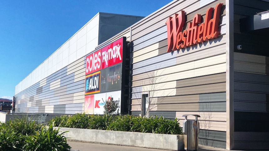 A Westfield shopping mall with the sign on the side.