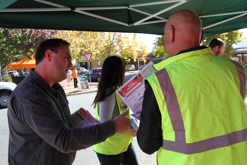 2019 Farrer Labor Candidate Kieran Drabsch talks to voters at an early voting centre in Albury.