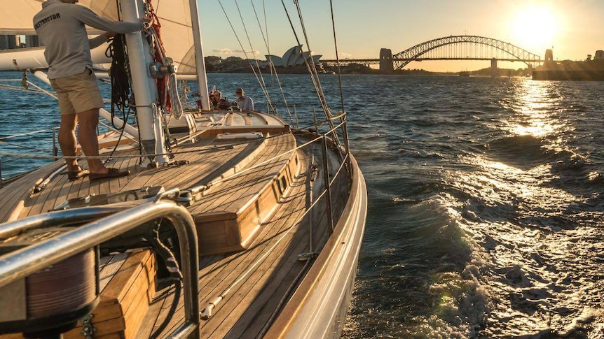 Looking across Southwinds' deck as the sun sets over Sydney Harbour.