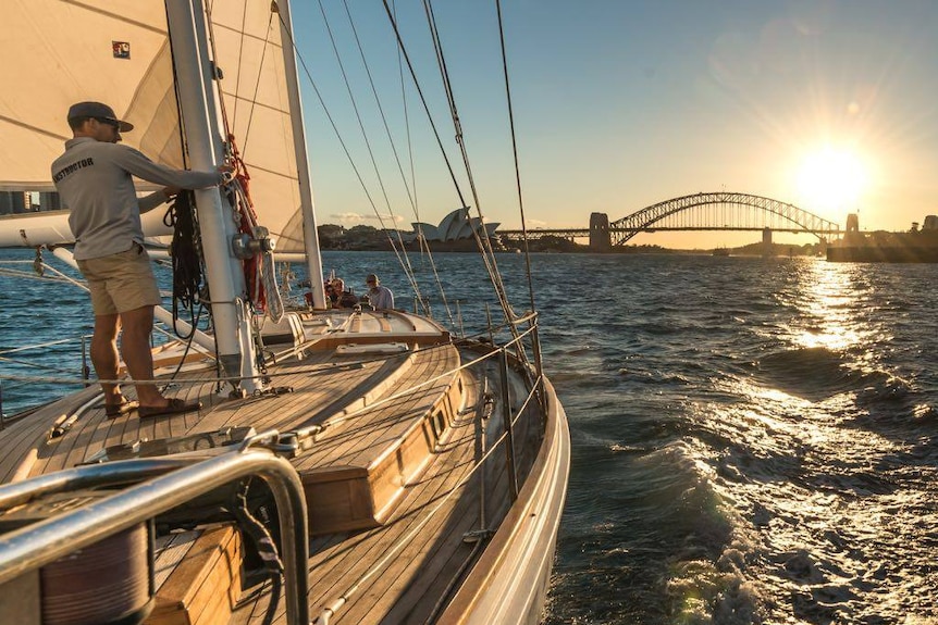 Looking across Southwinds' deck as the sun sets over Sydney Harbour.