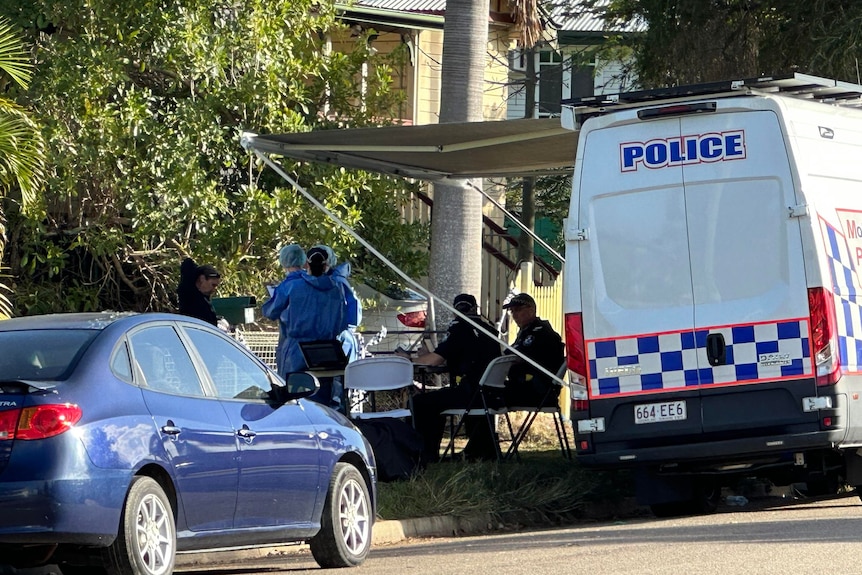 a police car and forensic police outside a home
