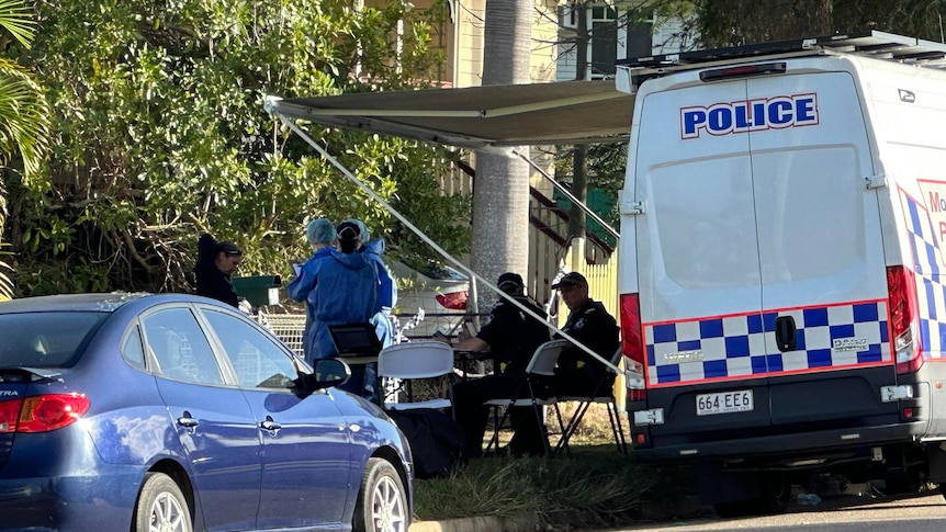 a police car and forensic police outside a home