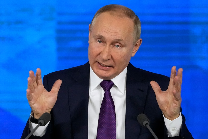 The Russian President gestures with his hands