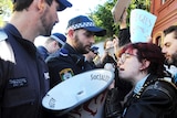 NSW Police push back protesters outside a Federal Labor Caucus meeting at Balmain Town Hall.