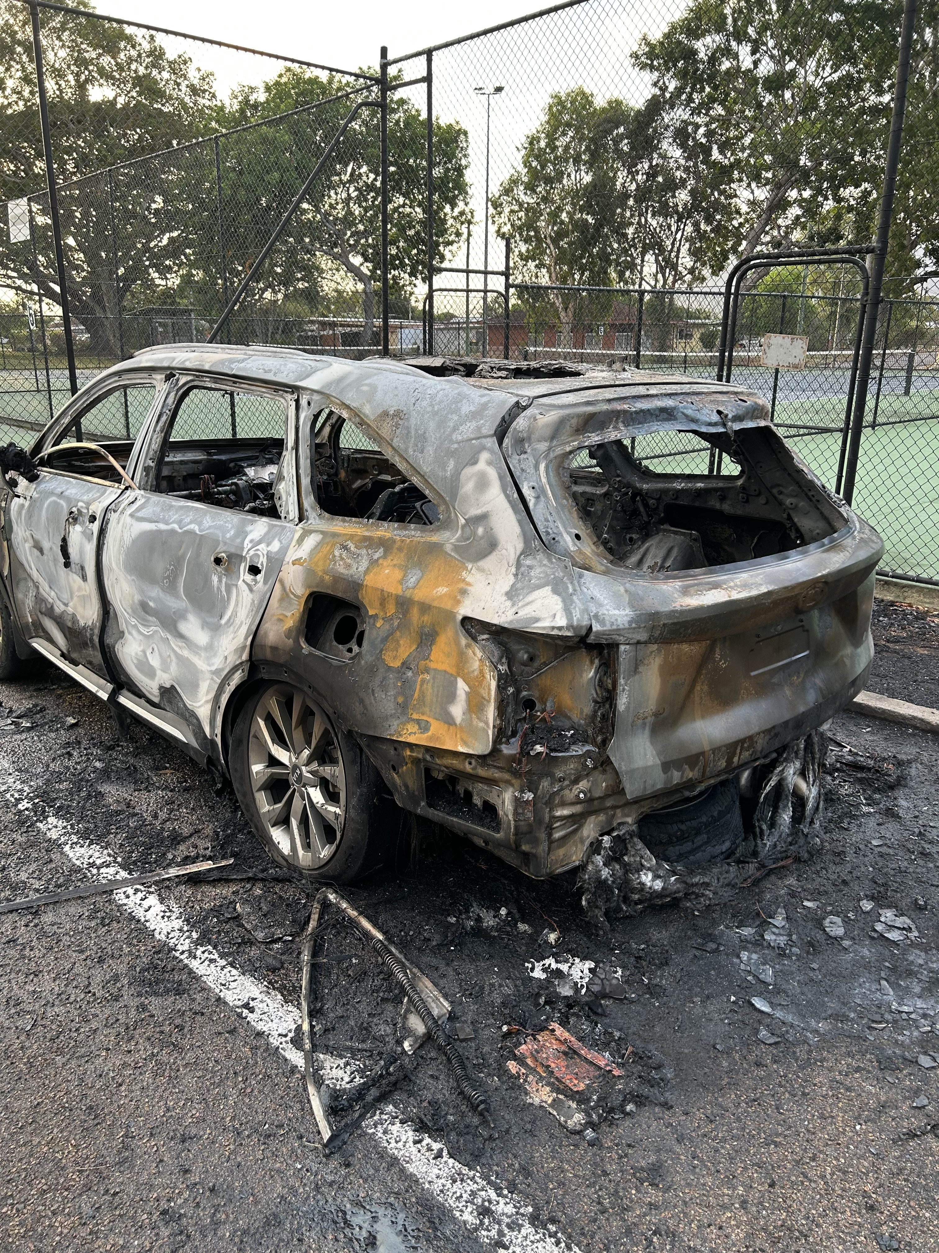 A car that was stolen sits burned out