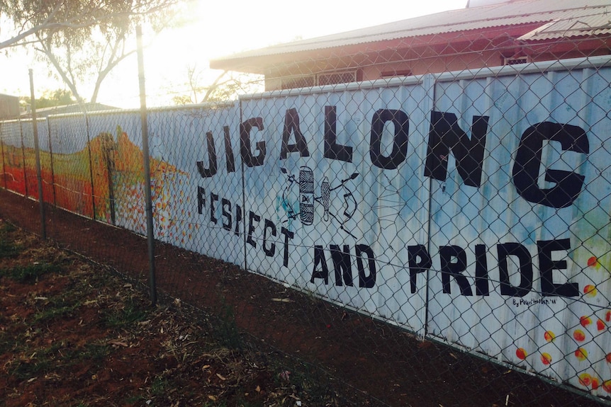 A sign saying Jigalong Respect and Pride with an emblem in the centre.