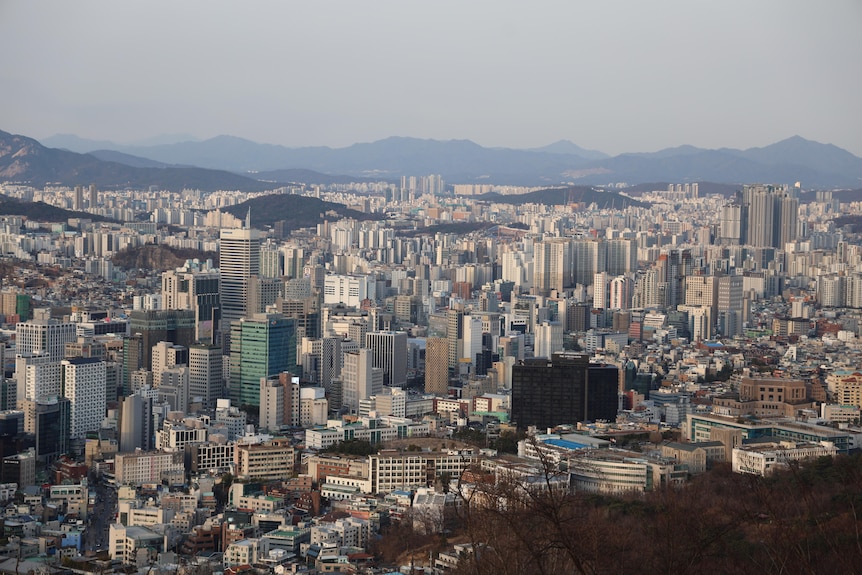 The skyline of Seoul, South Korea, filled with grey high-rise buildings