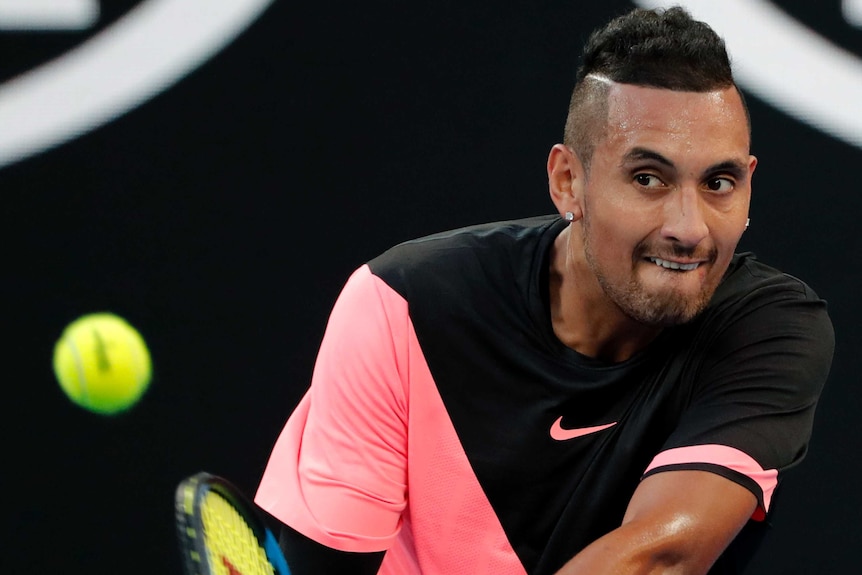 Nick Kyrgios plays a return against Viktor Troicki at the Australian Open.