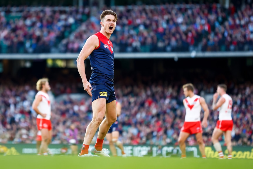 Bayley Fritsch gestures to the crowd after kicking a goal