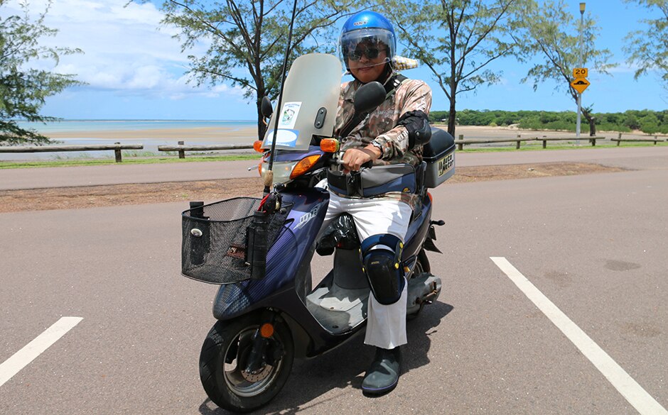 Hiroaki Nakamura rides towards his secret fishing spot, which is near East Point in Darwin