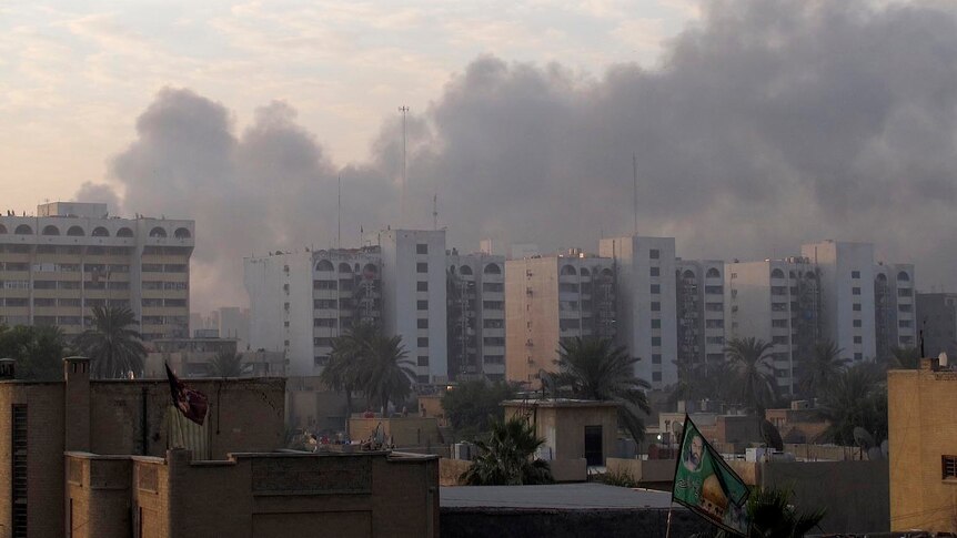 Smoke rises from the site of a bomb attack in central Baghdad on December 22, 2011.