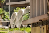 a large wavy sculpture outside the brisbane court precinct in the sunshine
