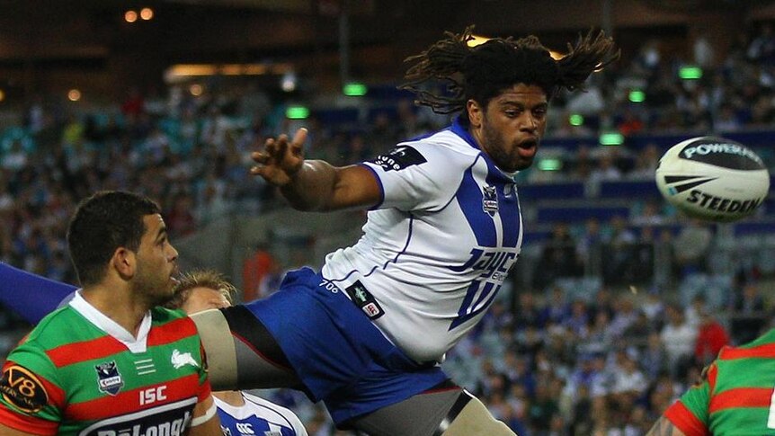 Flying high... Bulldogs centre Jamal Idris jumps for the ball at the Olympic stadium.