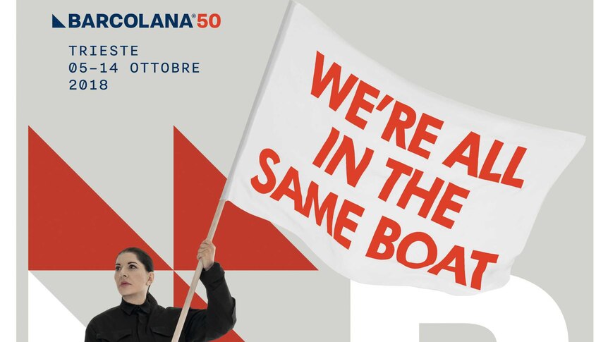 A poster showing a woman in black flying a white flag that reads "we're all in the same boat".