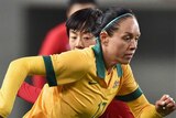 On the rise ... Kyah Simon takes on the China defence
