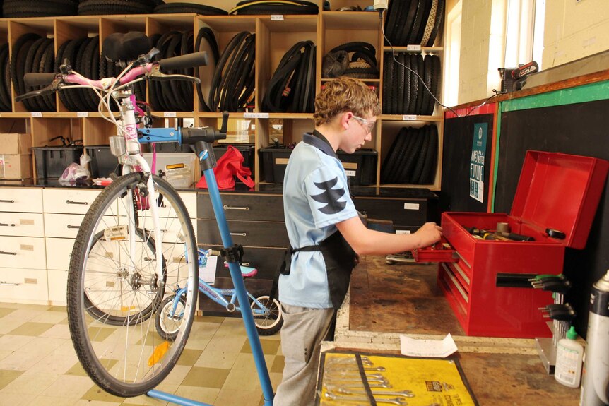 Student Cooper Good in the bike collective workshop.