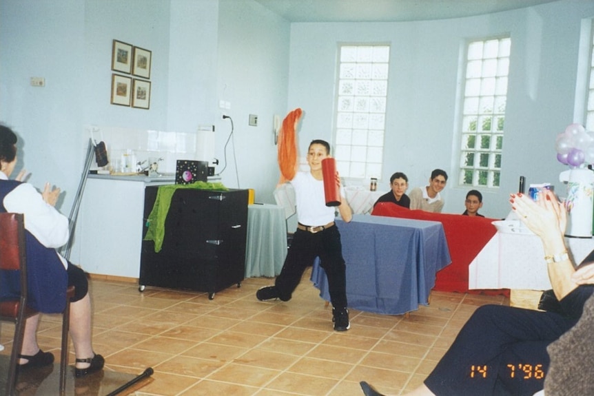 young boy doing a magic trick