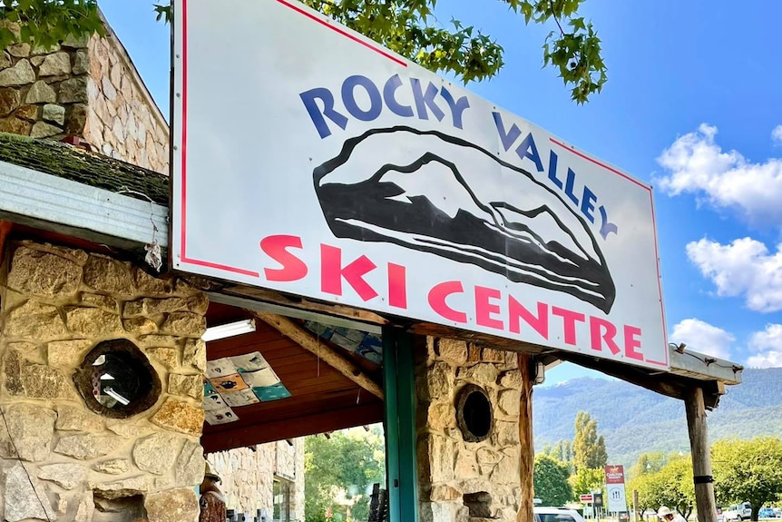 A building made of stone with mountain bikes around the entrance.