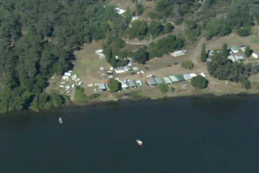 Emergency services are seen gathered round a boat ramp at a Hawkesbury River caravan park on May 28th, 2016.