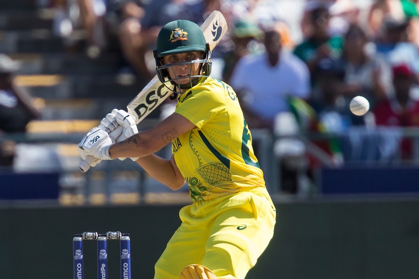 Australia's Ash Gardner waits with bat poised to hit a shot square on the leg side during the T20 World Cup final.