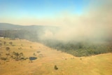 Aerial shot of fire crews and smoke at Shallow Bay